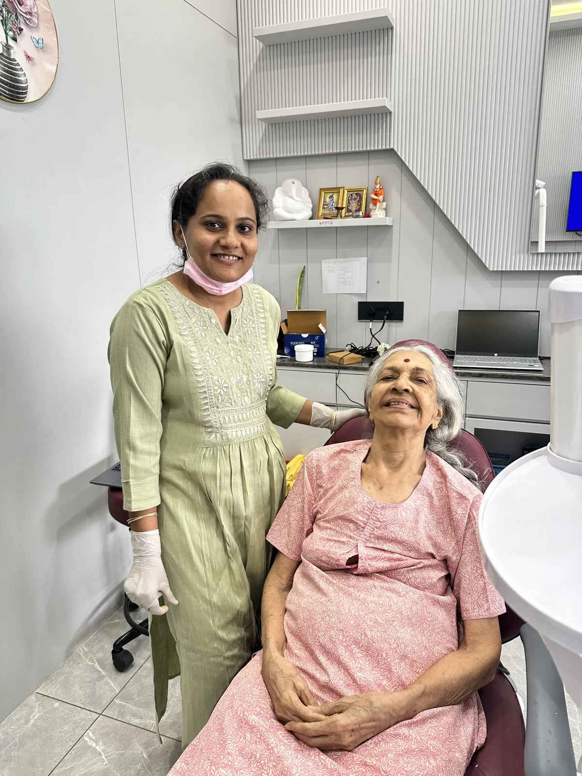 Dr. Rima Shah with an elderly patient at Anaya Dental Clinic