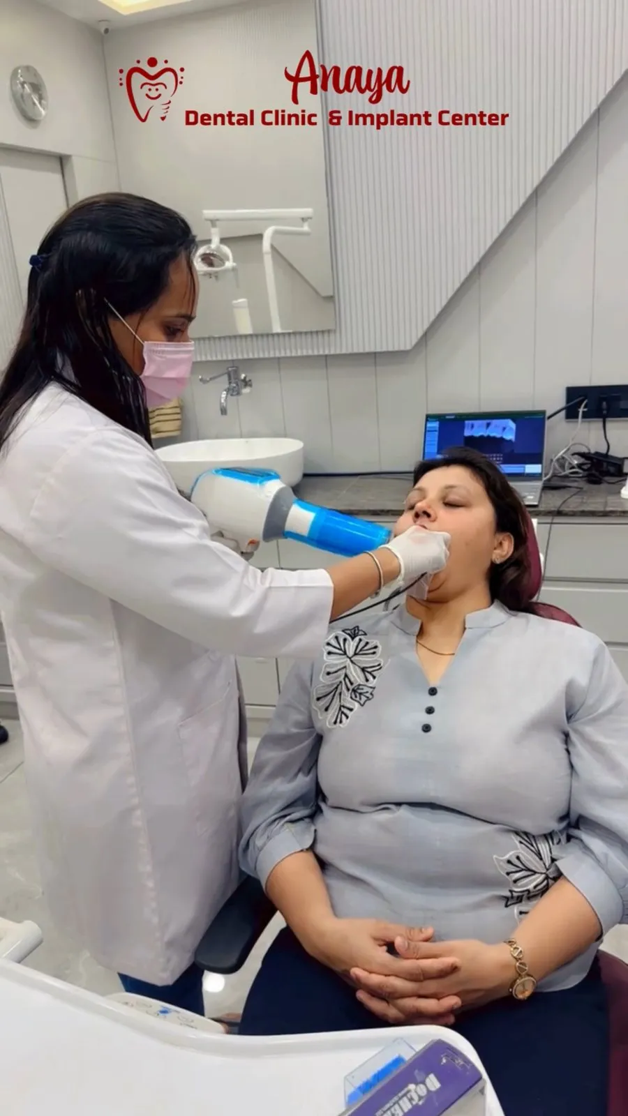 Dr. Rima Shah taking a dental X-ray of a patient at Anaya Dental Clinic